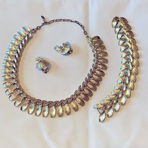 Signed LISNER Vintage necklace, bracelet, and clip on earrings. Light gold metal